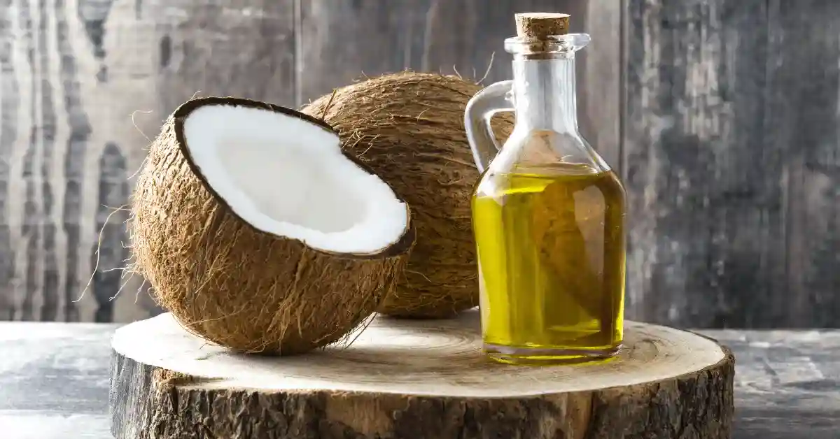 Best Hair Oils For Men Coconut oil on wooden background