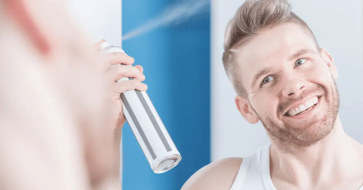 Best Hair Spray For Men: Metrosexual man using hair spray