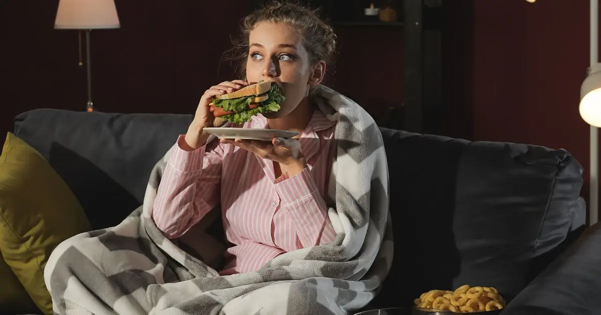 Beautiful Young Woman Eating Unhealthy Food at Night Beautiful Young Woman Eating Unhealthy Food at Night