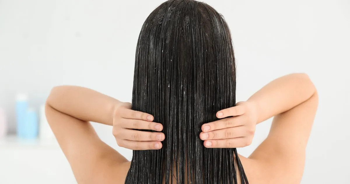 Woman Applying Hair Conditioner after Rinsing Hair Mask Woman Applying Hair Conditioner after Rinsing Hair Mask
